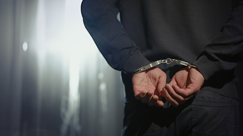 In handcuffs