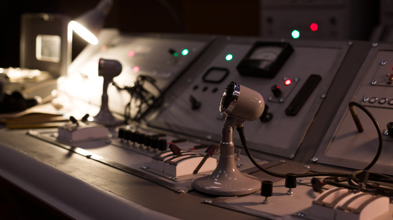 Vintage microphones on the control panel of a nuclear power plant