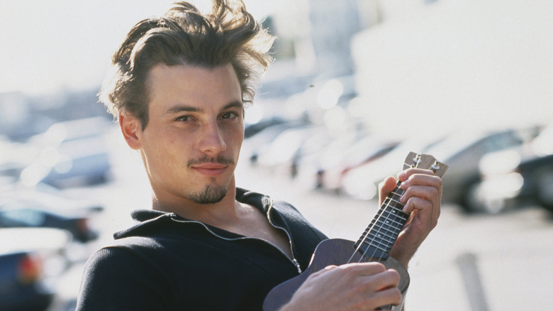 Skeet Ulrich strums ukulele 