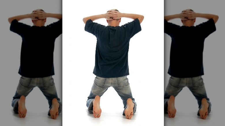 Man on knees arrest