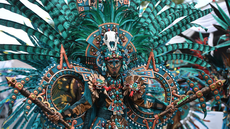 Man wearing traditional Aztec regalia