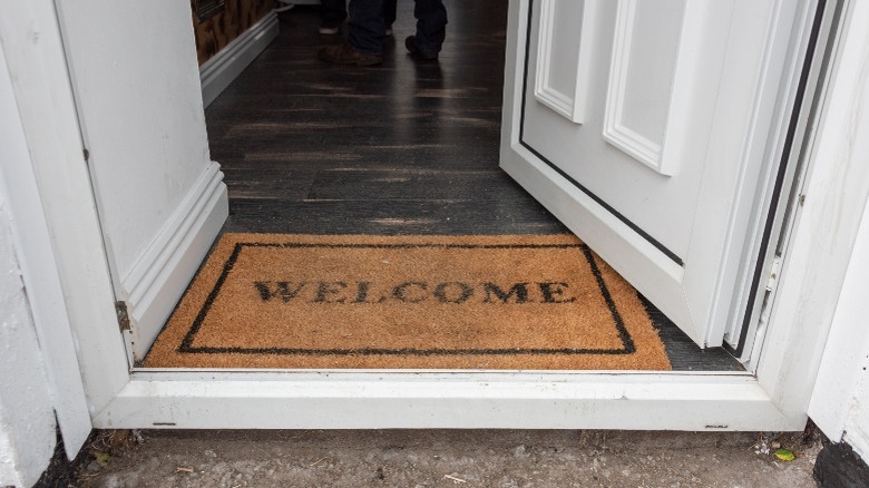 welcome matt open door