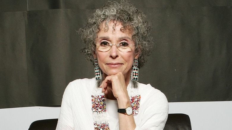 Rita Moreno head on hand