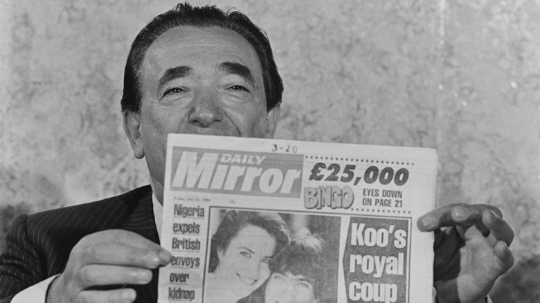 Robert Maxwell holding the Daily Mirror