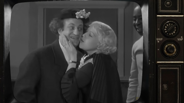 Larry Fine and Mabel Haney on TV set