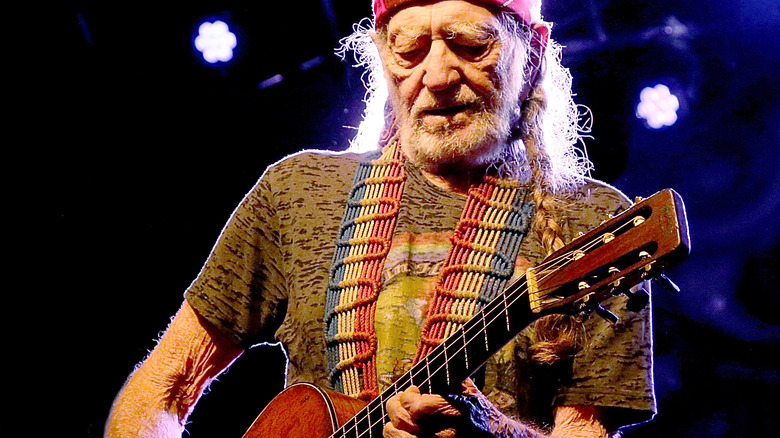 Willie Nelson playing guitar