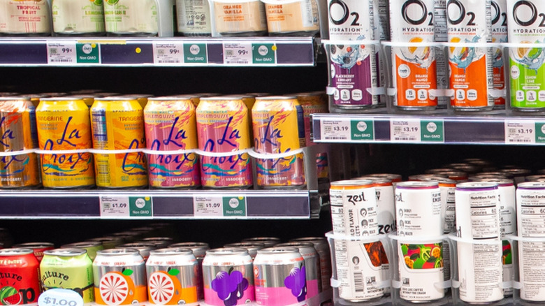 various drinks and sodas on grocery shelves