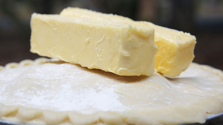 Margarine sticks on top of a pie
