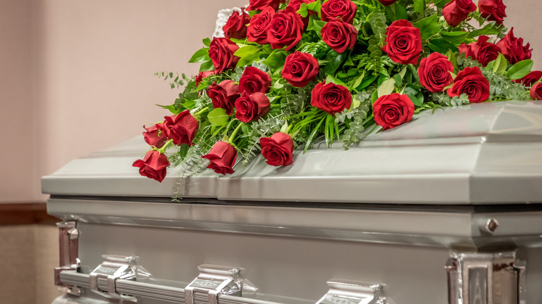 funeral casket with roses