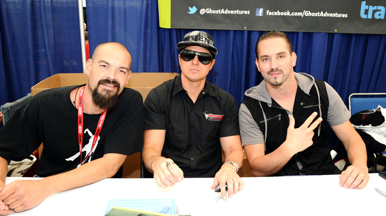 Ghost adventures hosts sitting at table