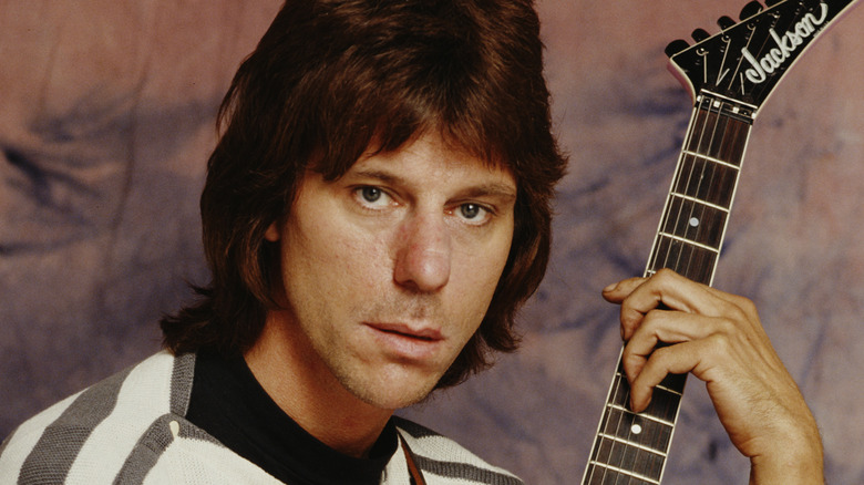 Jeff Beck holding guitar