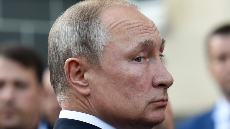 Putin looking over shoulder