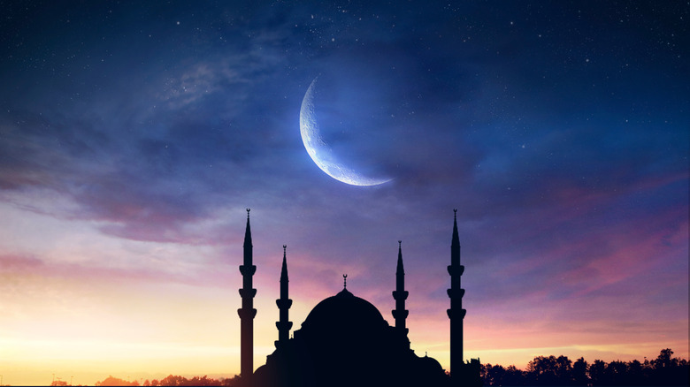 Mosque under night sky