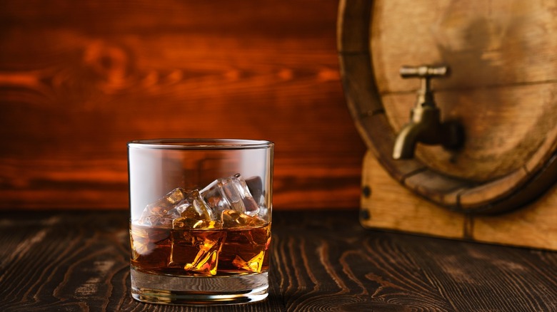 whiskey in front of barrel