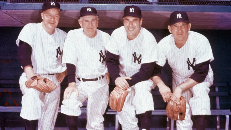Yankees players and manager kneeling