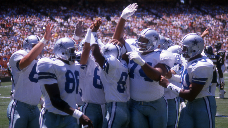 Dallas Cowboys players high-fiving