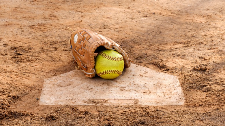 Softball glove and ball