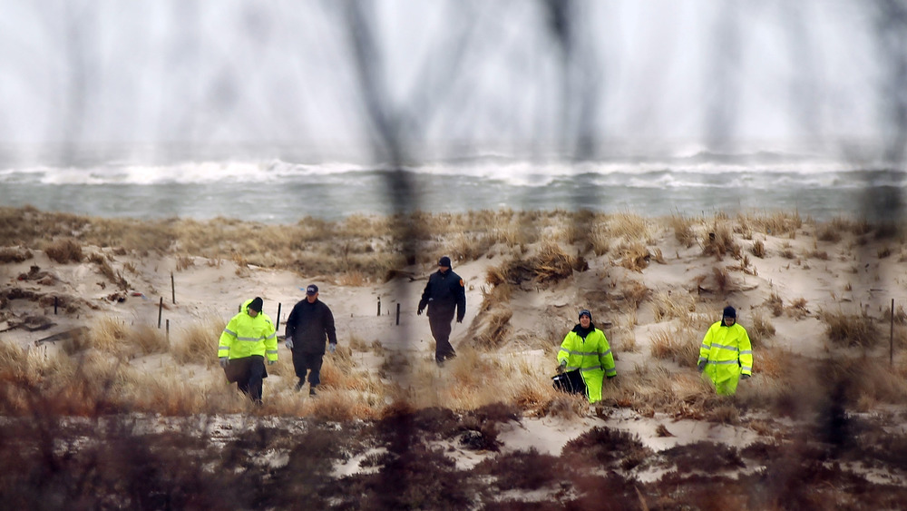 Investigators searching beach 