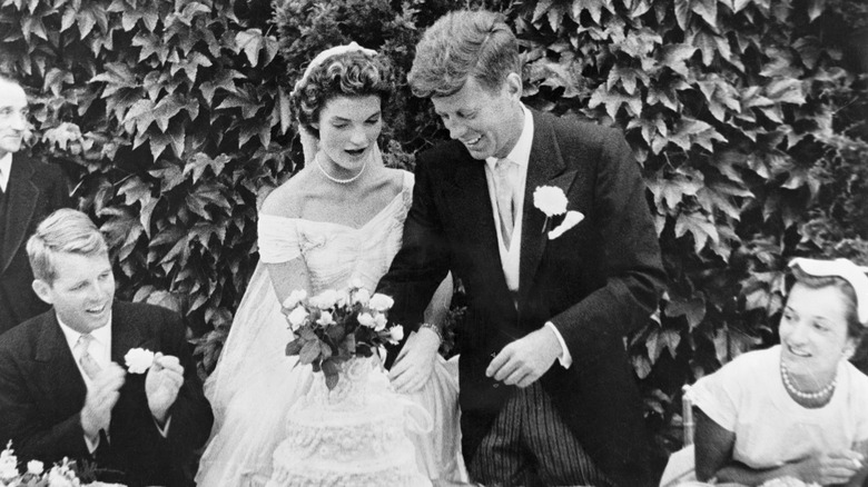 John and Jackie Kennedy cut the cake