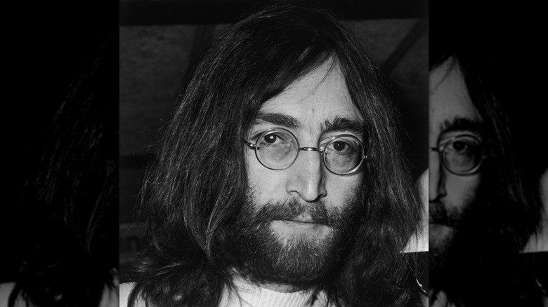 Close up of John Lennon with beard and long hair