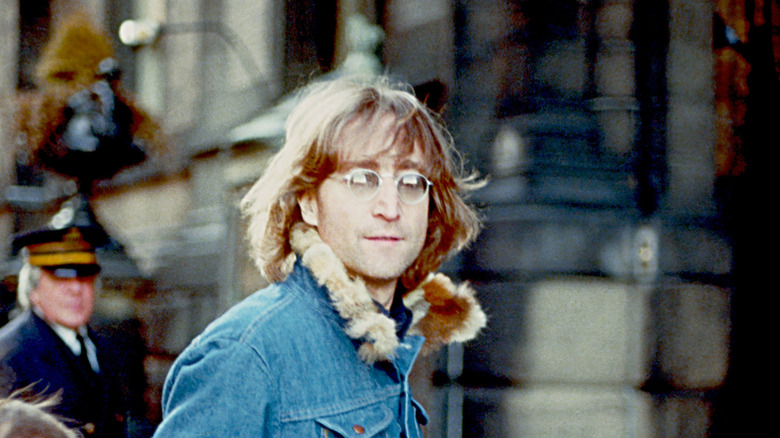 John Lennon wearing dark sunglasses