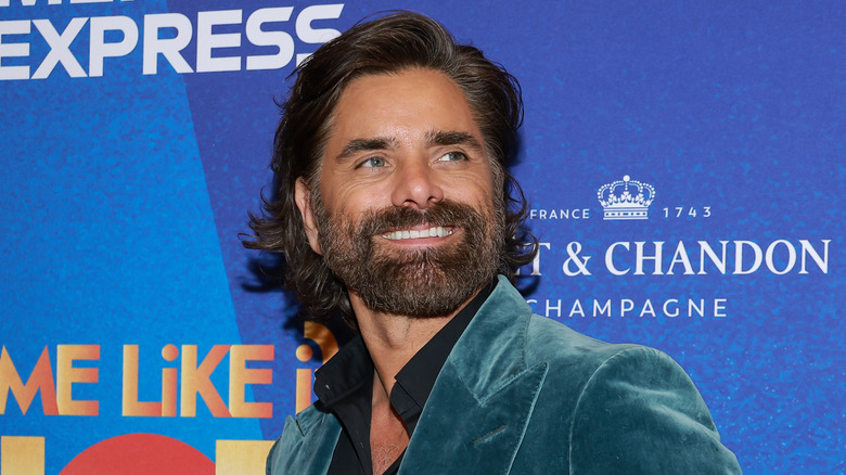 John Stamos bearded in blue velvet suit