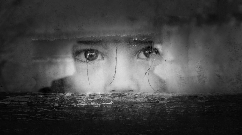 kid eyes broken window