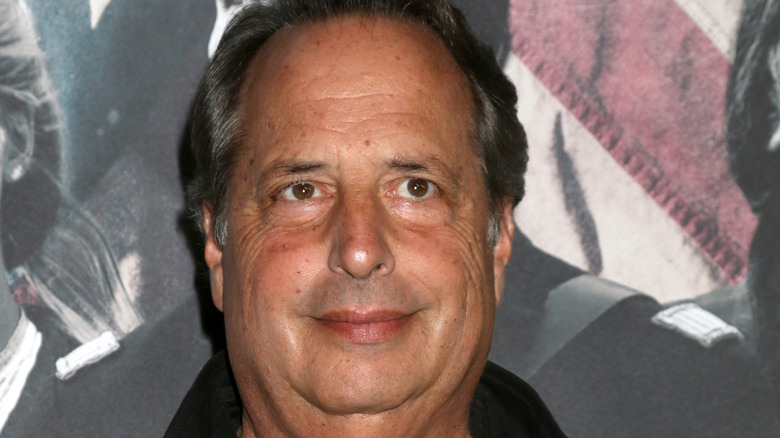 Jon Lovitz grinning