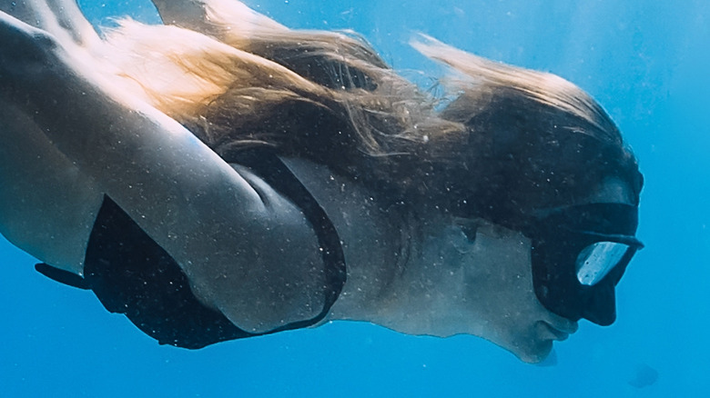 woman freediving diver