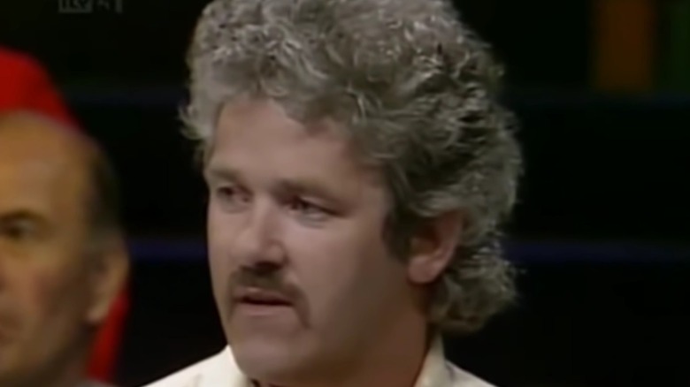 John Cooper talking with host during Bullseye appearance