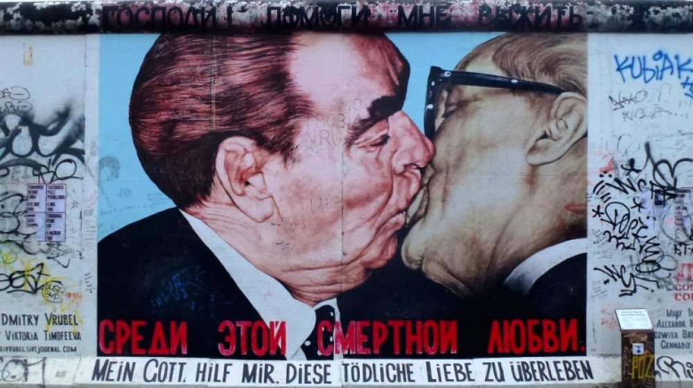 God Help Me Survive This Deadly Love graffiti on Berlin Wall