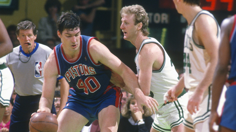 Bill Laimbeer posts up on Larry Bird