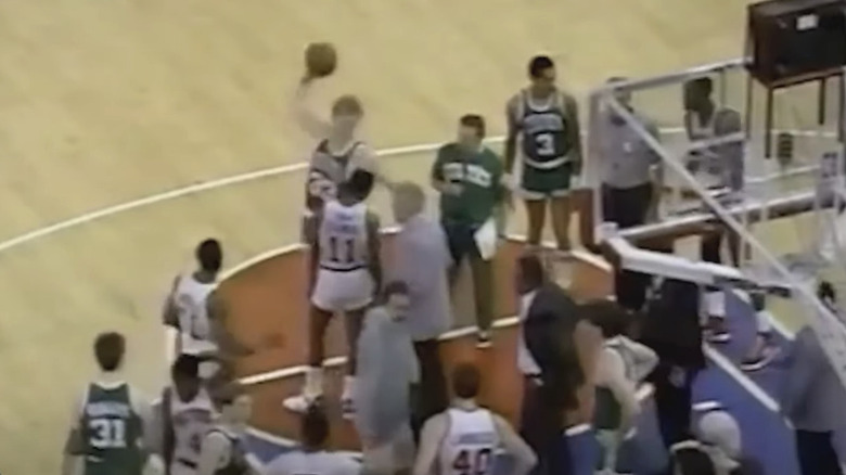 Larry Bird hurls basketball at Bill Laimbeer