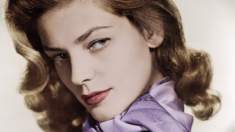 Lauren Bacall looks over her shoulder