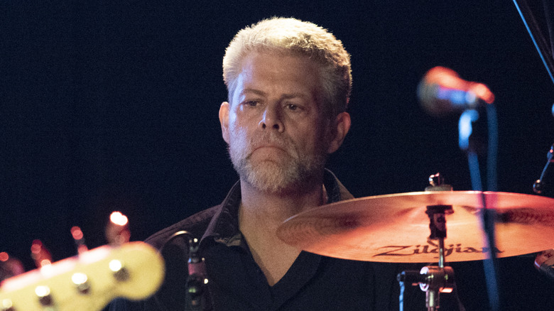 Barrett Martin sitting behind drums onstage