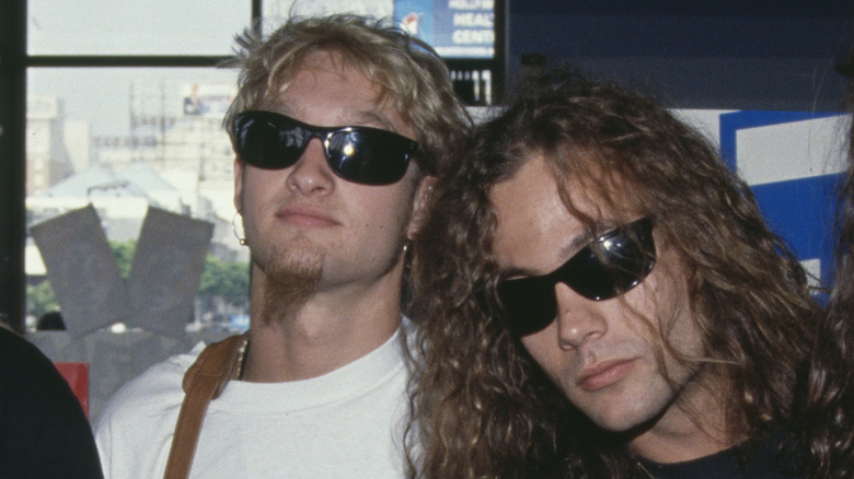 Mike Starr standing close to Layne Staley in sunglasses
