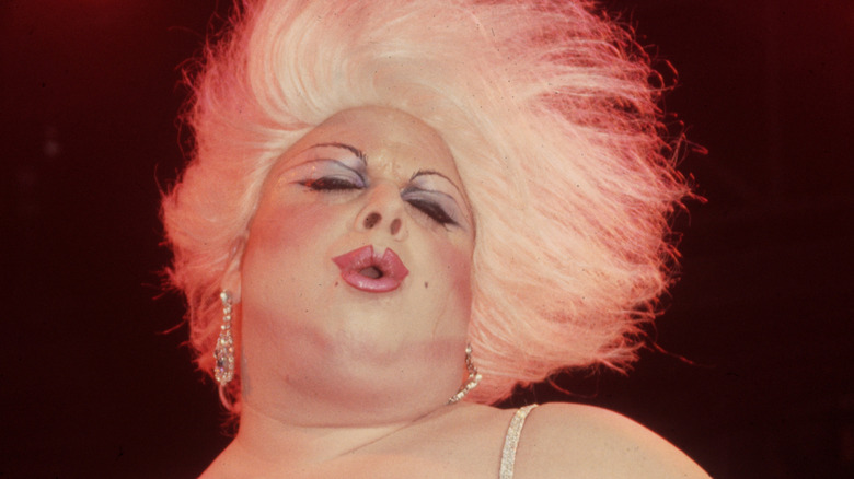 closeup of divine's face during a performance