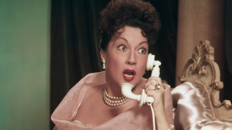 ethel merman answers the phone in a still from call me madam