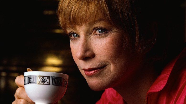 shirley maclaine drinking from teacup
