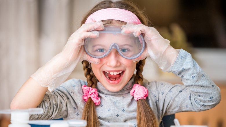 Little girl wearing lab glasses