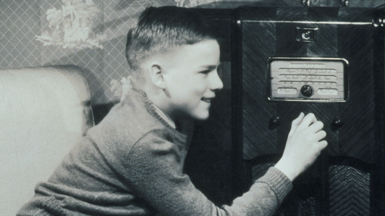 child listening to the radio in the 1950s