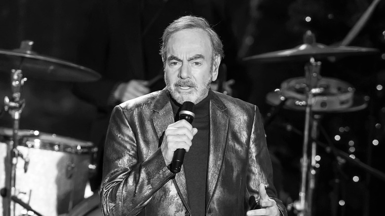 Neil Diamond performing with mic in hand