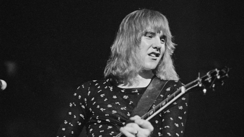 Alex Lifeson rocking out with a guitar onstage in April 1975