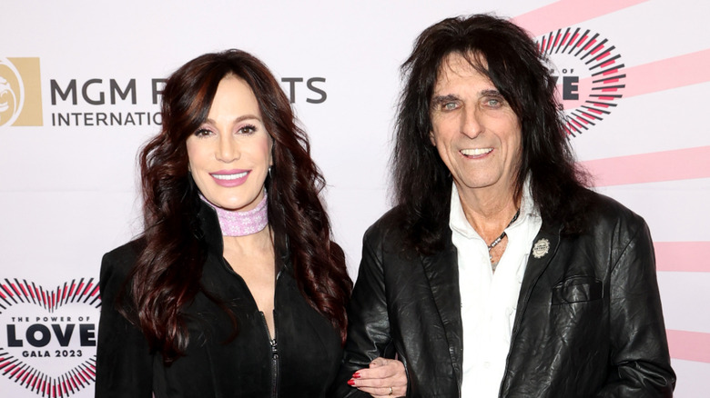 Alice and Sheryl Cooper smiling on the red carpet at a charity event in 2023