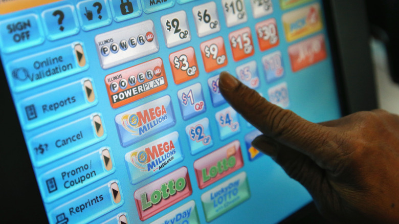 Computer screen with hand selecting lotto ticket
