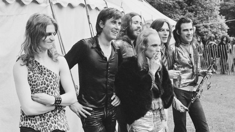 Roxy Music poses in front of tent