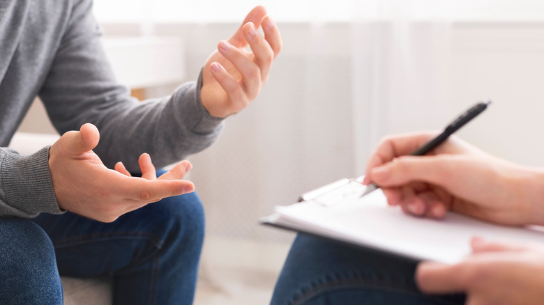 hands of two people talking