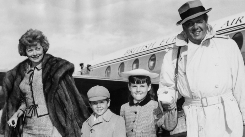 Arnoz family disembarks a plane