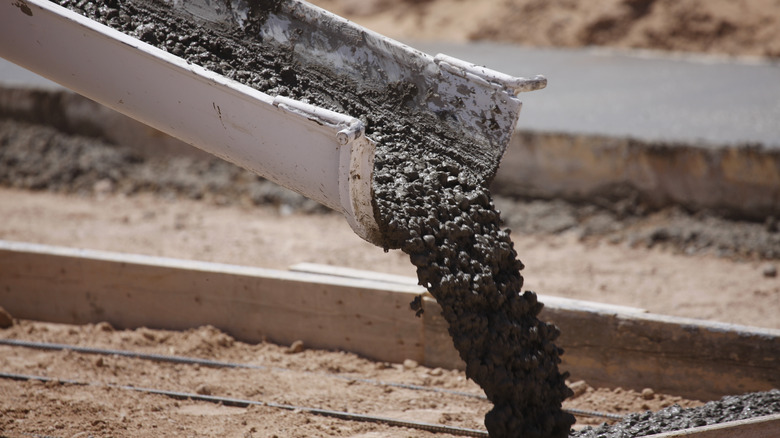 concrete being poured from mixer