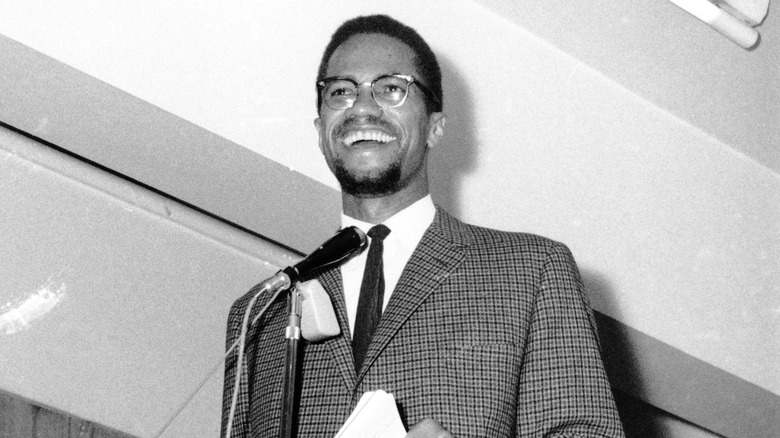 Malcolm X at microphone, 1964